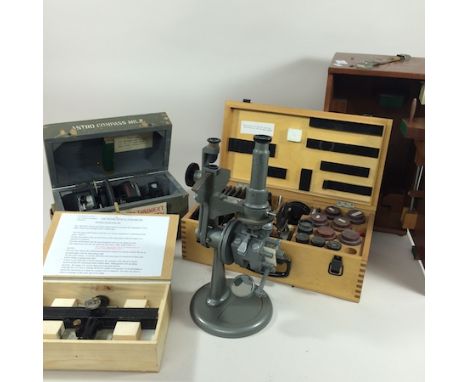 An astro compass, boxed, together with a refractometer, a cased set of accessories for a Russian inverted microscope and a we