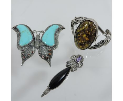 A silver and gem set brooch, in the form of a butterfly, together with another brooch and a bangle