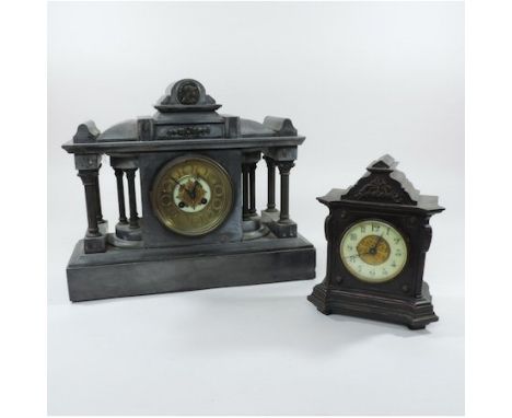A Victorian black slate mantel clock, together with an ebonised mantel clock