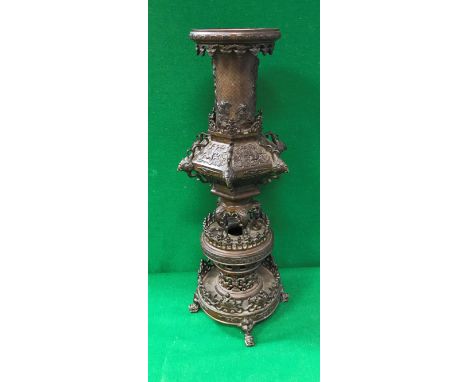 A late 19th Century Japanese Meiji period patinated bronze temple type vase in various sections with relief work decoration o