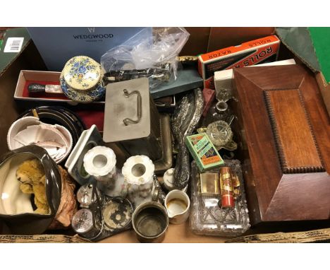 A box containing assorted items to include a carriage clock, a small mohair Schuco style bear, various cap badges and World W
