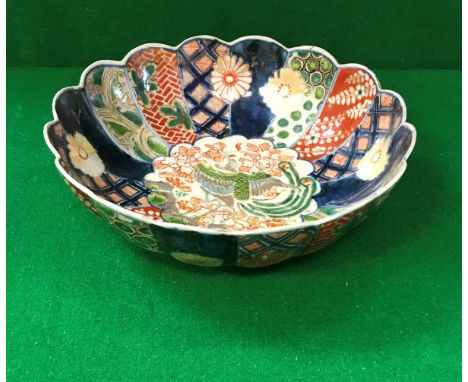 A Chinese Imari bowl of lobed form with polychrome decorated panels, bears faux Chenghua (1465-87) six character mark to base