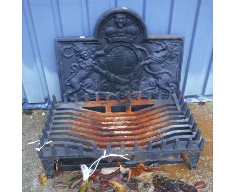 A cast iron fireback with lion and unicorn decoration, dated 1664, together with a cast iron fire grate and a wrought iron co