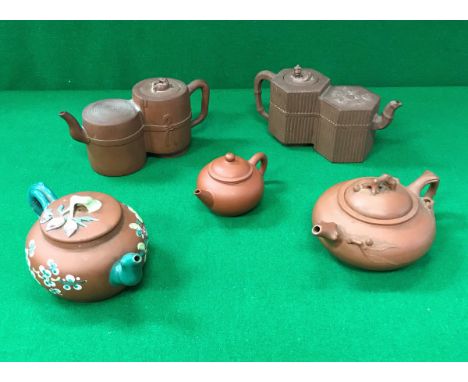 A collection of five Chinese Yi Xing teapots including a double chambered example with reeded decoration, bearing seal mark t