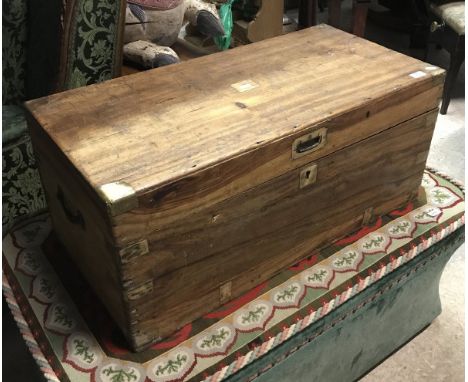 A 19th Century camphor wood trunk with brass corners and embellishments