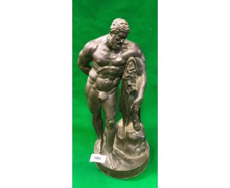 A bronze figure of Hercules leaning on his club