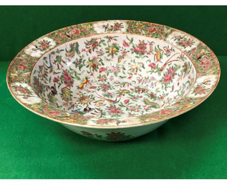 A 19th Century Chinese famille-rose bowl, the centre field decorated with birds and butterflies amongst blossom, the flared r