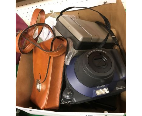 A Fuji Instax instant camera and two film packs, a Polaroid 103 instant land camera, a Polaroid SX-70 land camera and case to