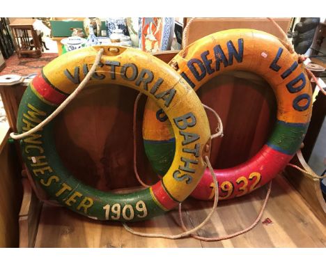 Two vintage design painted lifebuoys inscribed "Victoria Baths, Manchester 1909" and "Saltdean Lido 1932"