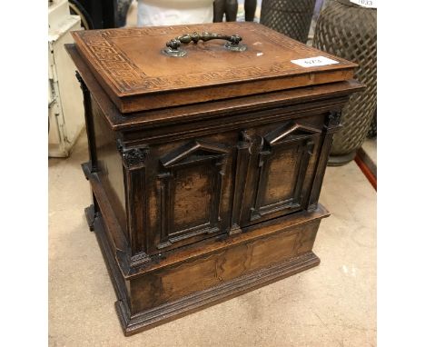 A 19th Century mahogany and inlaid box, the rising lid opening to reveal three sections, the exterior with architectural desi