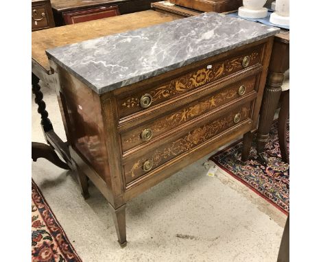 A 19th Century French marble topped commode/chest, the three drawers with marquetry inlaid decoration depicting figures, bird