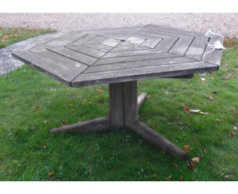 A hexagonal wooden garden table