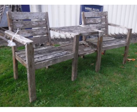 A teak twin garden chair and table set
