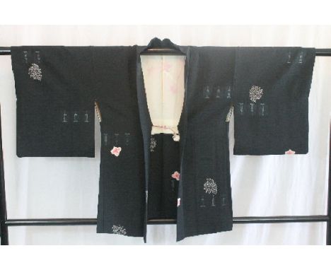 A circa 1940 silk haori (jacket) with Shibori (tie-dyed) decoration on a black ground