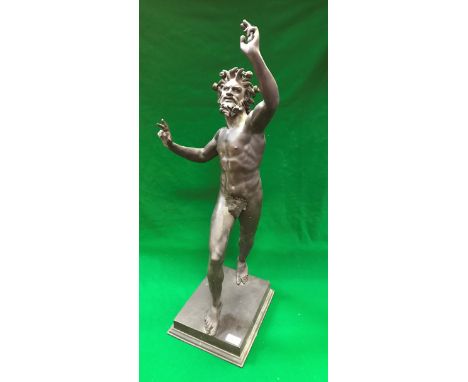 A bronze figure of Bacchus with fruit bearing band in his hair and strategically place fig leaf