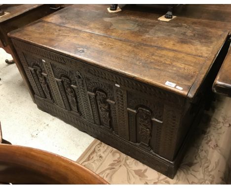 An oak coffer in the 17th Century manner, the plank top with cleated ends opening to reveal a candle box and slim shelf over 