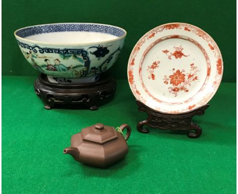 An 18th Century Chinese export ware polychrome decorated bowl, together with a carved and turned hardwood stand, an oxide red