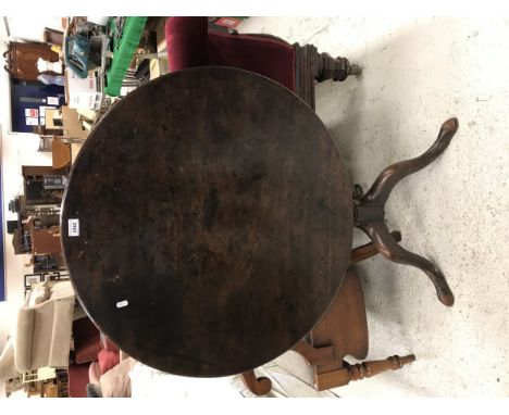 A George III mahogany tea table, the circular snap top on a turned and ringed pedestal to cabriole tripod base and pad feet