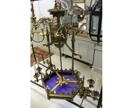 A circa 1900 Continental (probably French) brass electrolier in the French Gothic revival or baroque taste with winged beast 