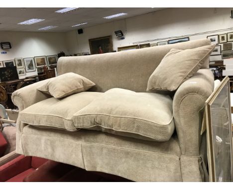 A modern fawn upholstered scroll arm two seat sofa 