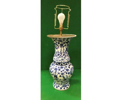 A Chinese blue and white porcelain vase as a table lamp with all-over floral decoration CONDITION REPORTS Modern.  Has genera