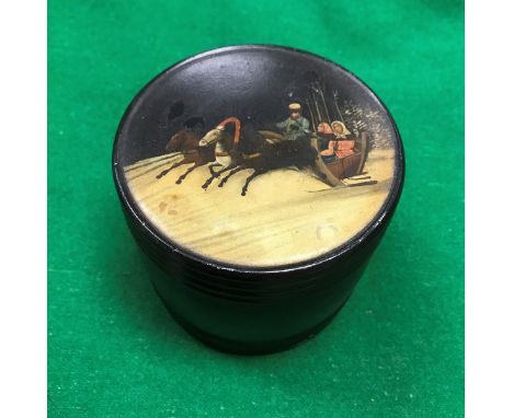 A 19th Century Russian lacquered cylindrical tea caddy, the top decorated with figures in a troika