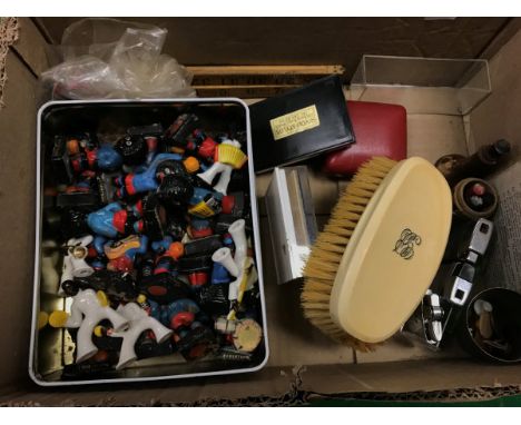 A box of assorted sundry items to include a collection of Robinson's Gollies, a pair of early 20th Century ivory mounted hair