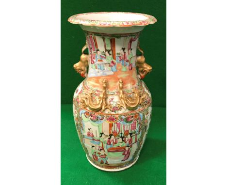 A 19th Century Chinese famille-rose vase with relief work dragon and temple lion decoration, the main body painted with figur