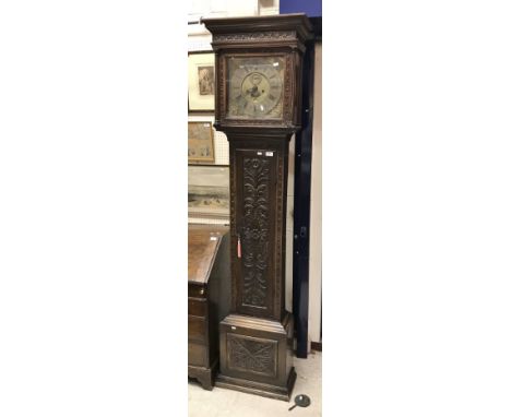 An 18th Century oak cased long case clock, the eight day movement with square brass dial and silvered chapter ring with Arabi