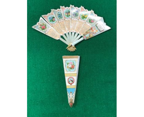 A Victorian printed cardboard fan of arrow form inscribed "The Language of Flowers, A Merry Christmas" with various studies o