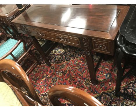 A Chinese hardwood three drawer side table CONDITION REPORTS Basically sound throughout.  Top with a glass ring mark and some