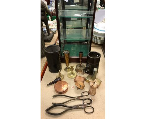 A Victorian leather jack, a Victorian wooden tankard with stamp, two pairs of coal tongs, a wooden spinning top, brass candle