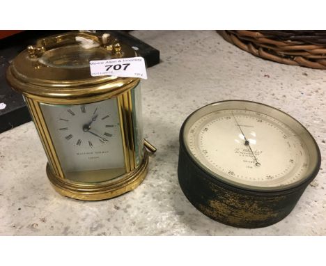 A Matthew Norman five glass carriage clock of oval form stamped "Swiss made" to base together with a T. Wheeler brass cased c
