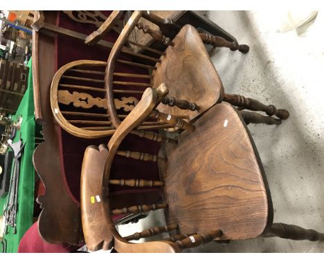 A 19th Century oak stick back Windsor elbow chair together with a 19th Century oak captain's chair