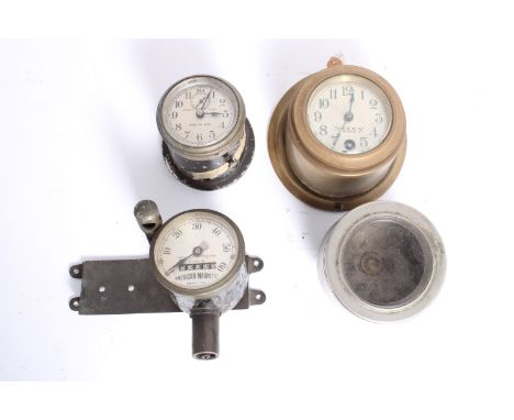 An American Magnetic Model 102 speedometer,0-60mph, 2 1/2 inch diameter bezel, on mounting bracket with light stalk; together