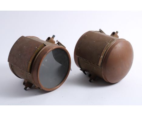 A pair of model number 7 drum-shaped acetylene headlamps by Atwood Mfg Co, America circa 1908,brass with copper rim and rear,