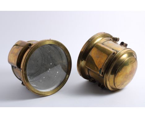 A pair of  Solar drum-shaped acetylene headlamp shells, American, circa 1908,brass with 9 inch diameter lens, (lacking reflec