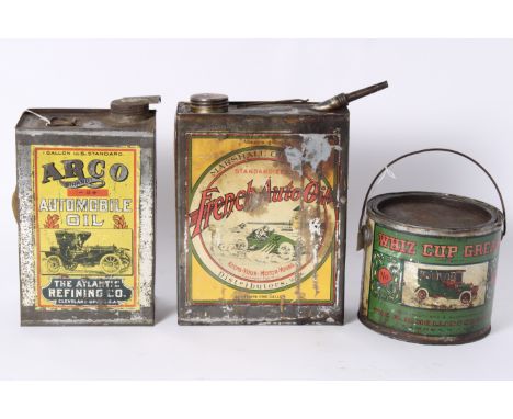 Three decorative Oil and Grease tins,comprising French Auto Oil 1 gallon with cap and spout; Argo Automobile Oil by The Atlan