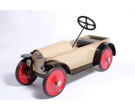 A Custer child's electric car, 1920s,lacking engine, recent restoration of paint work  in beige and black, (unrestored) seat,