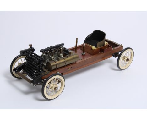 A model of Ford 999,wooden chassis, detailed metal engine, radiator, fuel tank, (lacking steering tiller), 11 inches long, (o