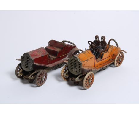 Two veteran racing car electric models,circa 1905, each tinplate body, one painted red the other orange, on chassis with cent