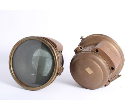 A pair of acetylene headlamps by Corcoran Lamp Co, American,one complete with 8 1/2 diameter inch lens and mirror, the other 