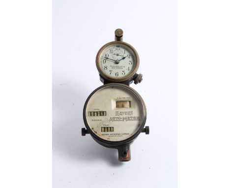 A Haynes Auto-Meter dual instrument cluster by the Warner Instrument Co., American, circa 1910,comprising speedometer with mi