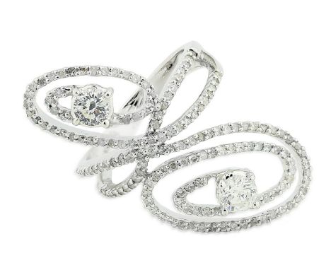 DIAMOND RING Of cross-over design, each terminal respectivelydecorated with two round brilliant-cut diamonds weighing approxi