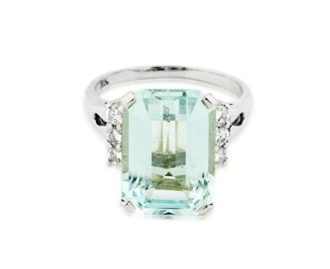 AQUAMARINE AND DIAMOND RING Centered by a cut cornered rectangular step-cut Aquamarine weighing approximately 8.70 carats, se