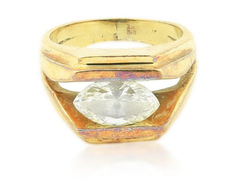 DIAMOND RING Centering a horizontally set marquise-cut diamond weighing approximately 1.36 carats, mounted in 14 karat yellow