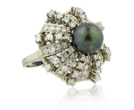 CULTURED PEARL AND DIAMOND RING Centering a cultured green black pearl measuring approximately 9.3 by 9.25 mm, framed by roun