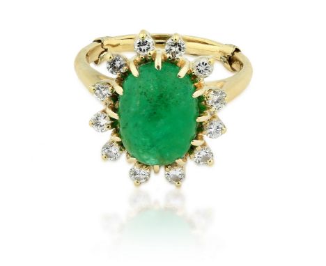 EMERALD AND DIAMOND RING 14 Karat Yellow Gold, Emerald and Diamond Ring Centering on a cabochon emerald weighing approximatel