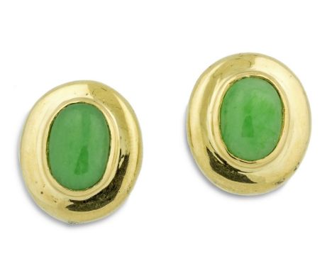 YELLOW GOLD JADE EAR CLIPS Centering an oval cabochon-cut green jade, surrounded by a gold frame, mounted in 14 karat yellow 