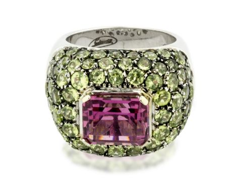 SALAVETTI, GEM-SET RING Centered an emerald-cut pink tourmaline, surrounded by pave-set round faceted chrysoberyl mounted in 